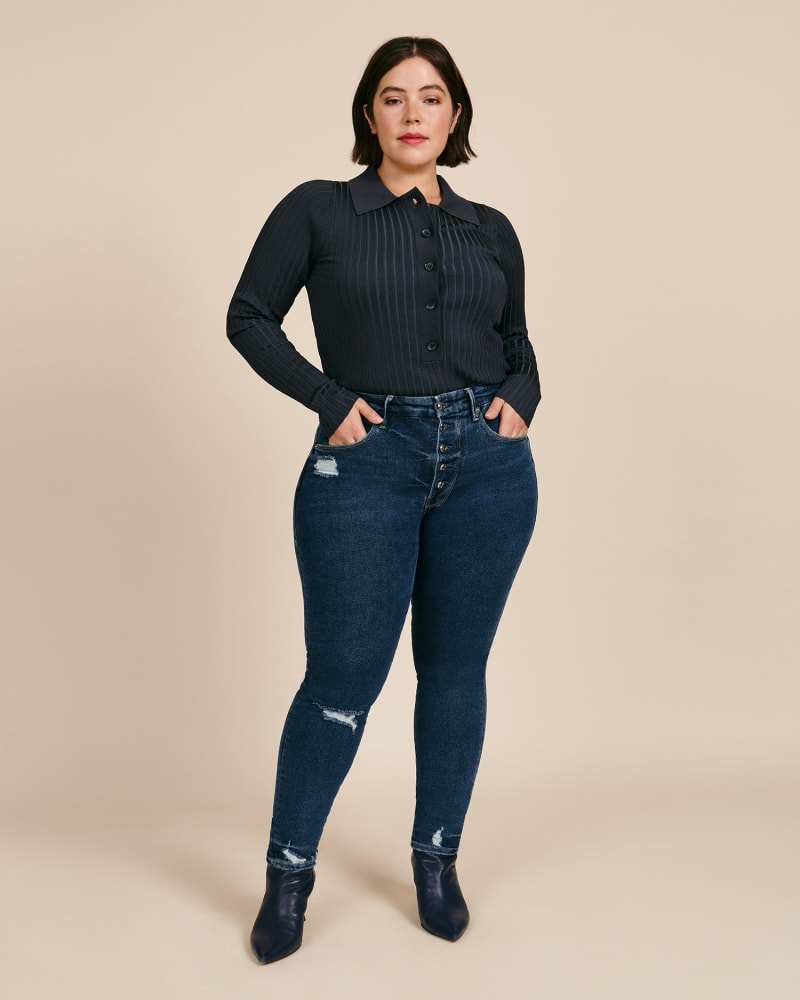 Front of a model wearing a size 12 Good Waist with Exposed Buttons in Blue by Good American. | dia_product_style_image_id:226403
